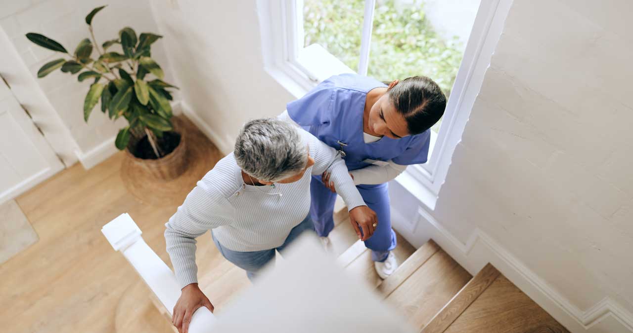 Senior care worker supporting a resident